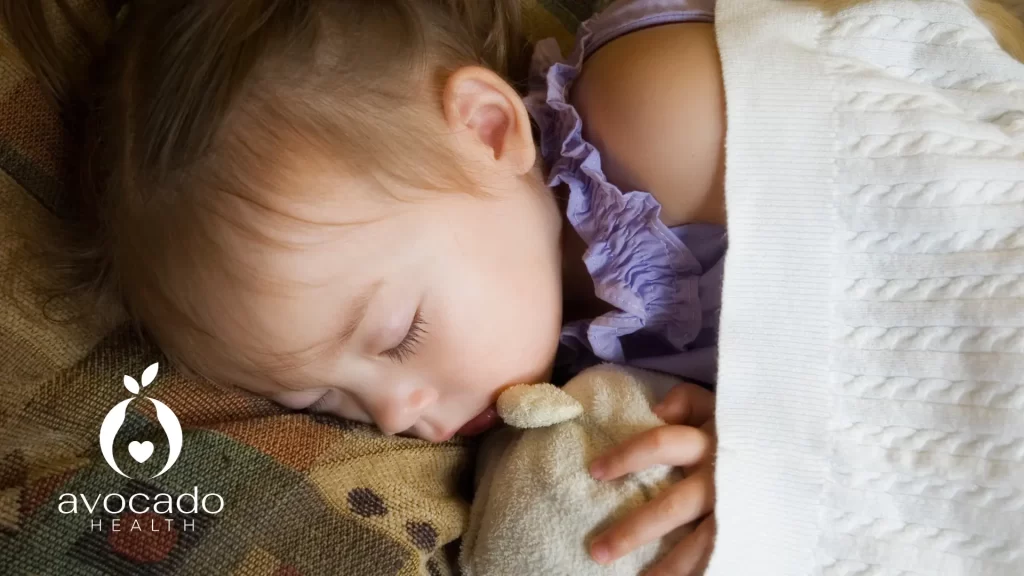 How to deal with separation anxiety in toddlers: A toddler sleeps peacefully while holding a soft toy for comfort at How to deal with separation anxiety in toddlers: A toddler sleeps peacefully while holding a soft toy for comfort at How to deal with separation anxiety in toddlers: A toddler sleeps peacefully while holding a soft toy for comfort at night