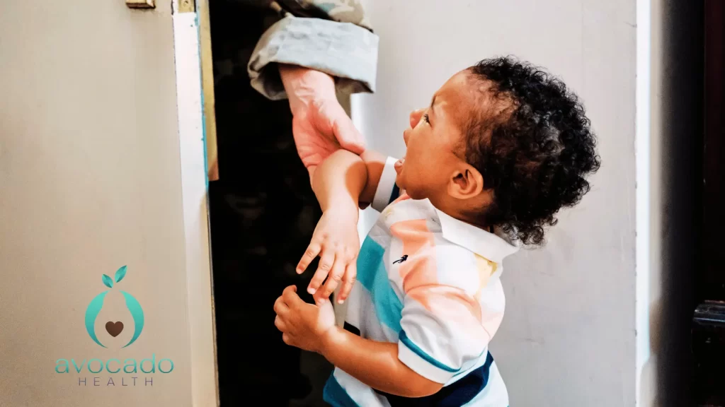 A toddler cries as their primary caregiver leaves, showing signs of separation anxiety