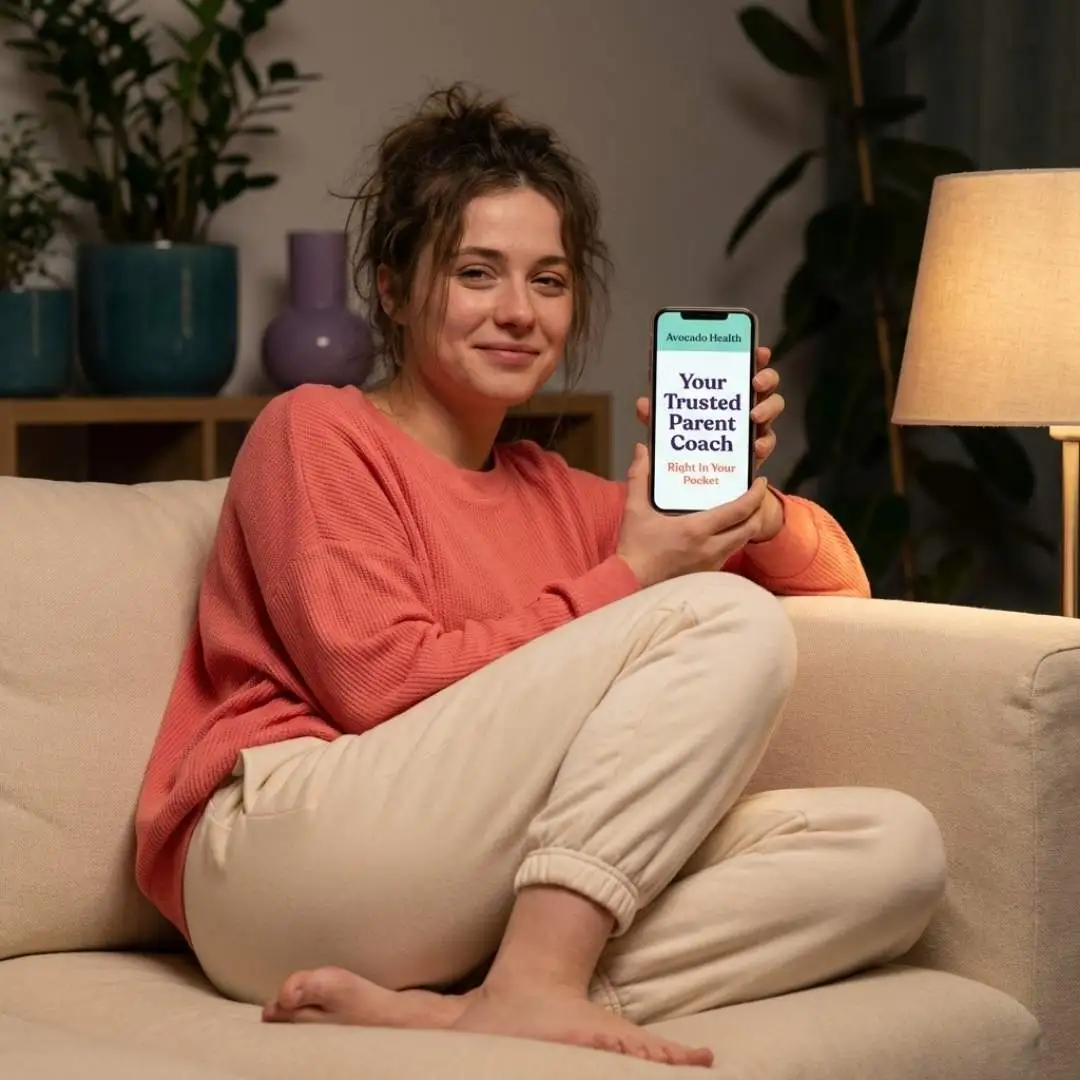 A parent using Avocado Health on her phone